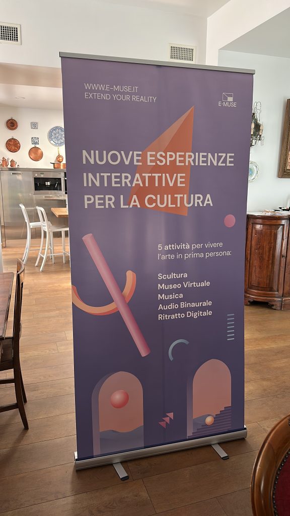 A roll-up advertising immersive experiences, standing sadly in a living room