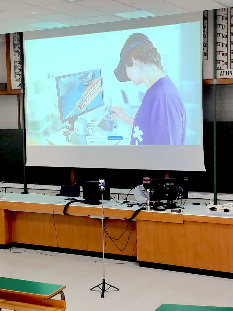 Presenter showing off VR use-cases at a university desk, using a projector
